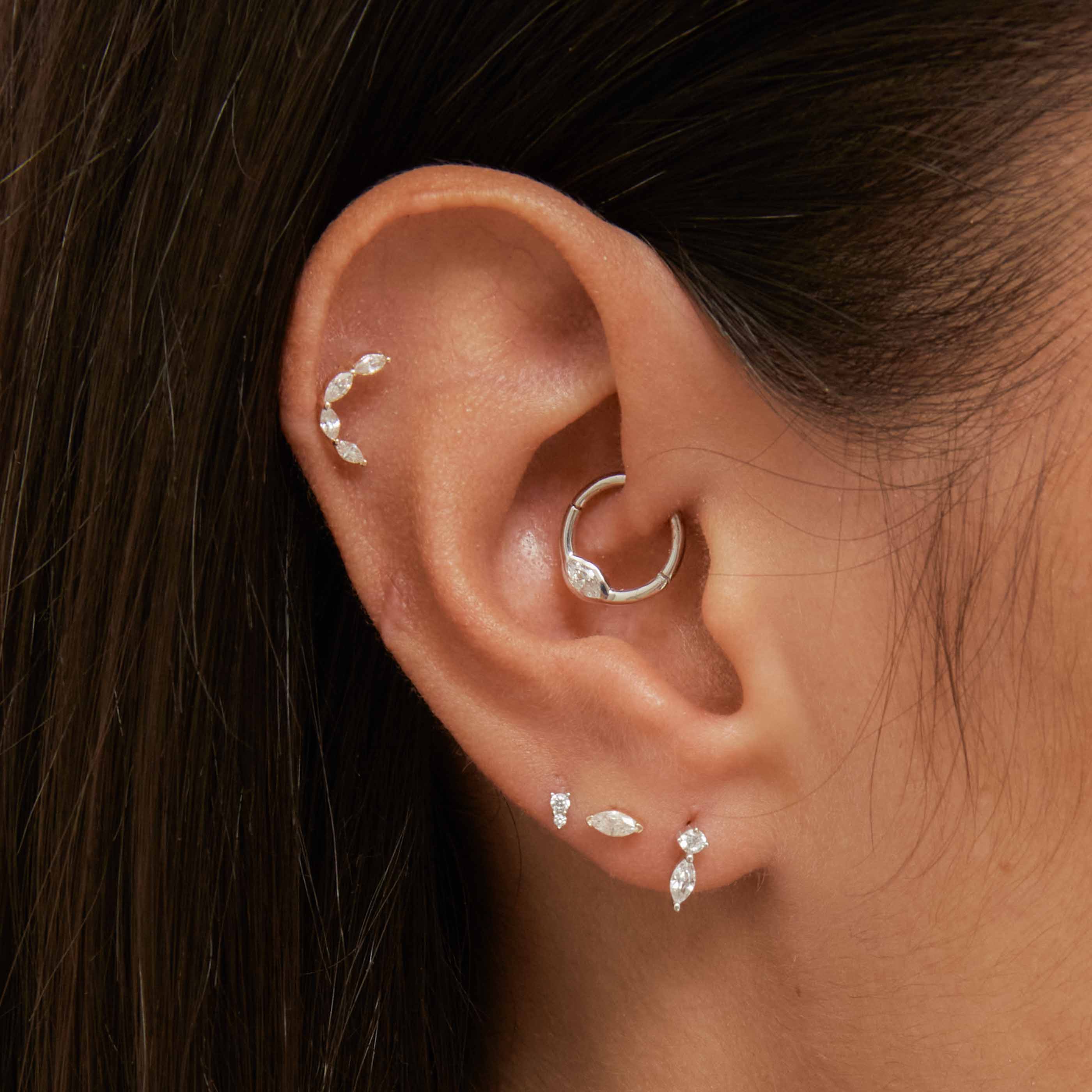 Laura Bond - solid gold huggies, helix, tragus, conch & daith earrings